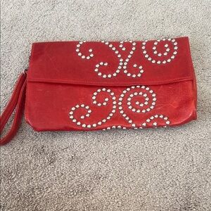 Red leather studded clutch bag by McFadin Stacy & Laurie.